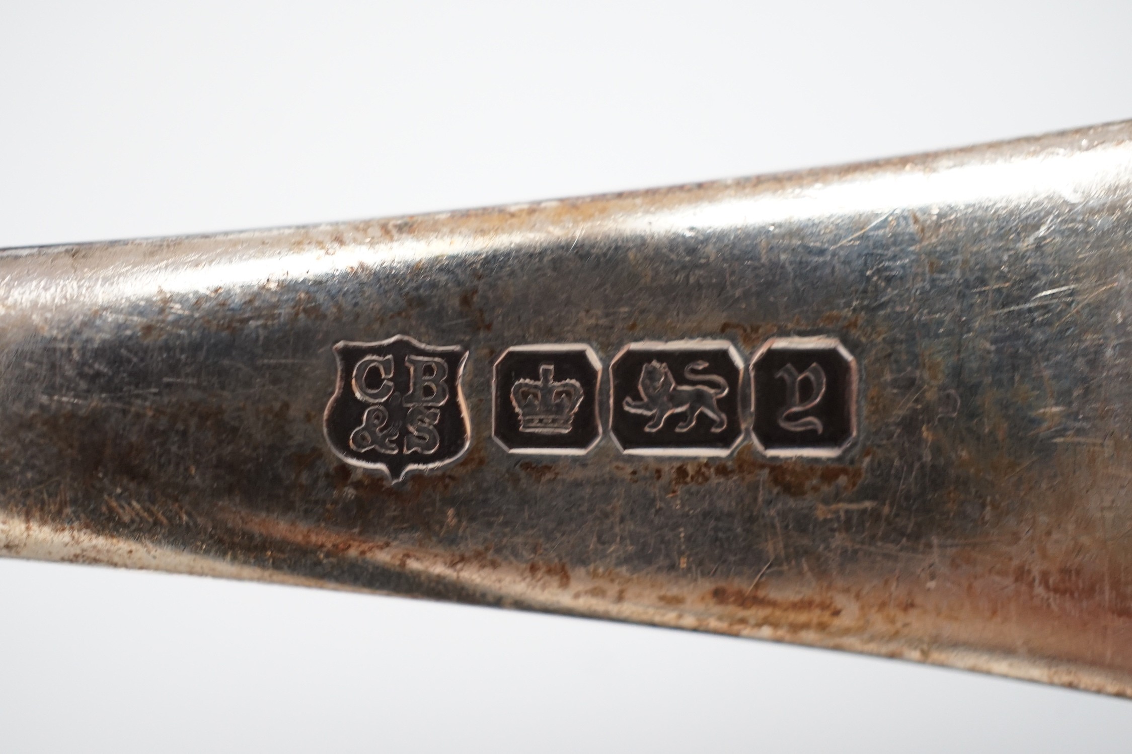 A set of six George V silver seal top coffee spoon, cased, and a pair of George V silver old English pattern fruit spoons, Sheffield, 1916, cased.